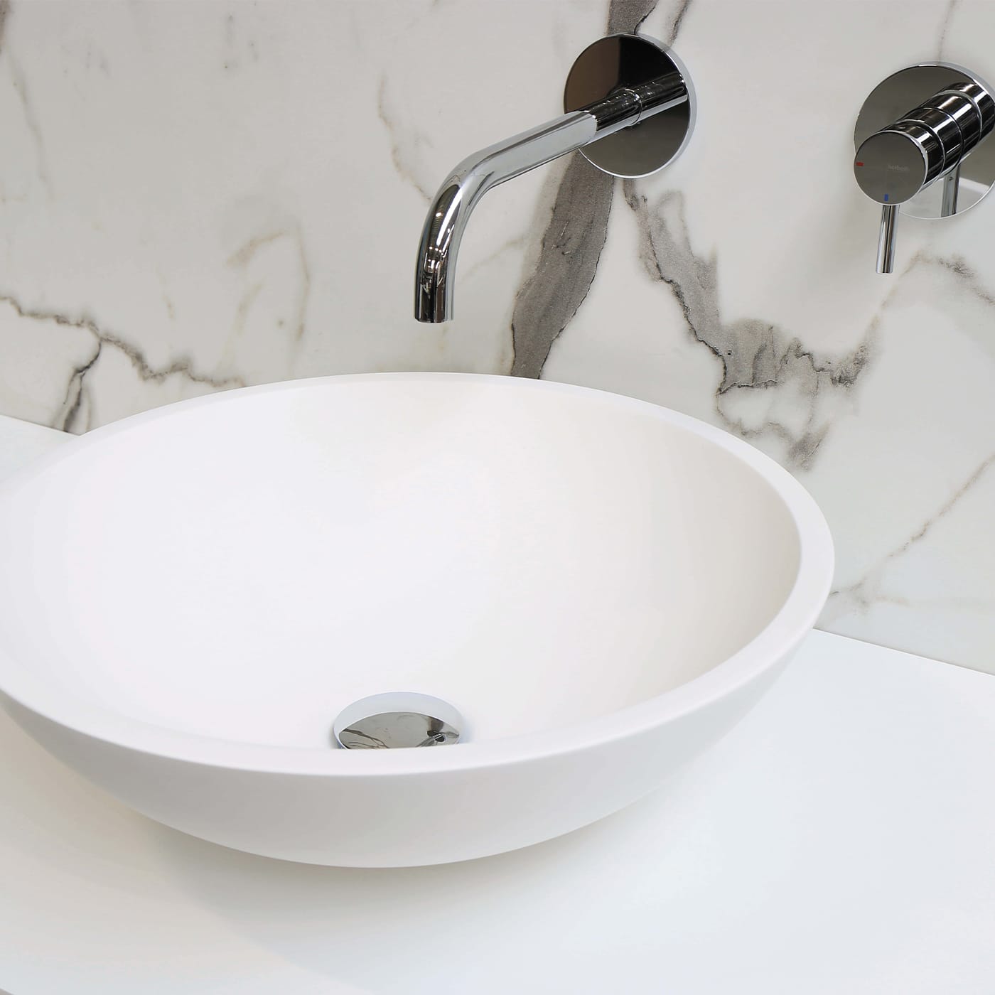 how far should faucet extend into sink
